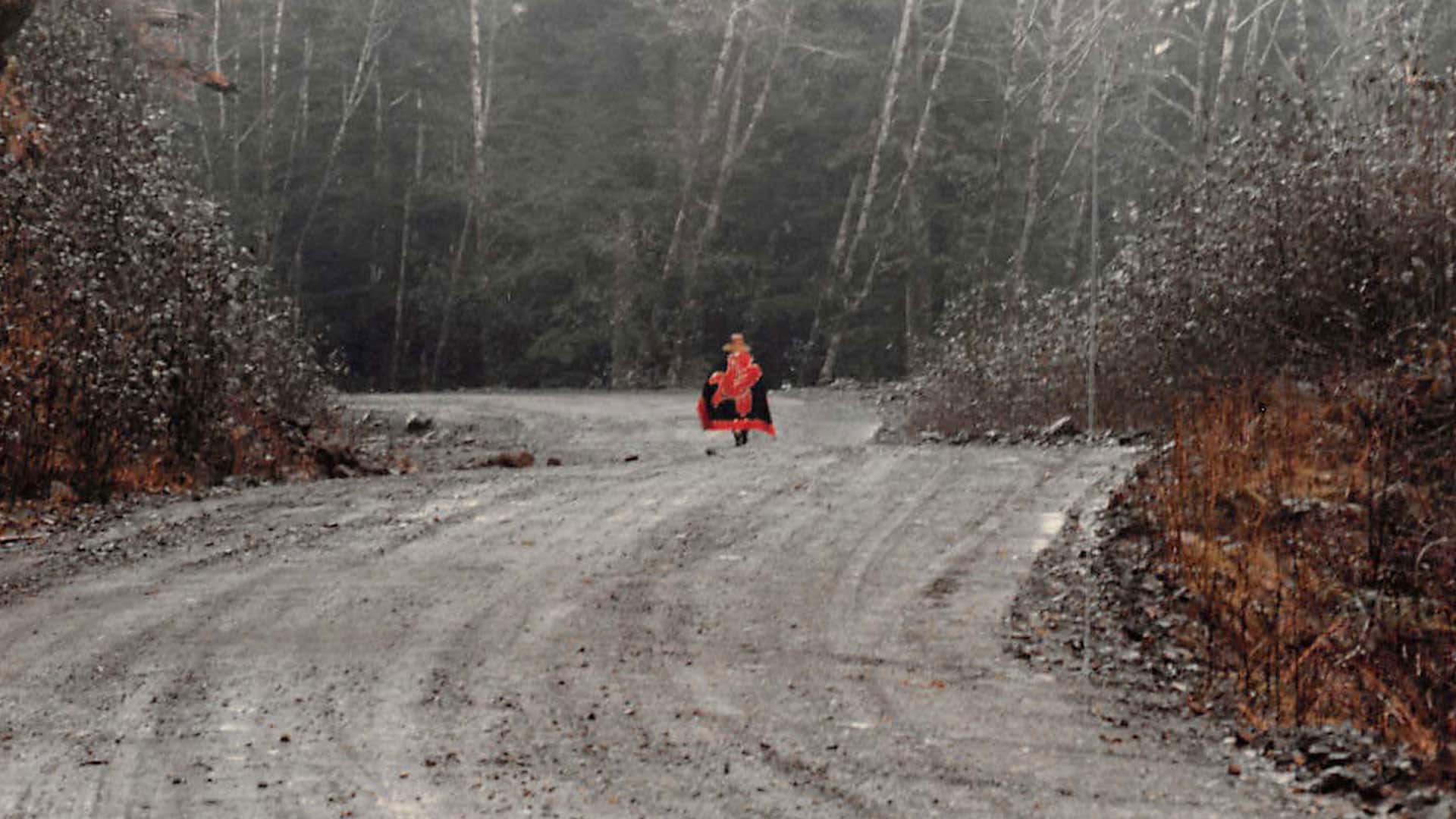 A lone protester walks to the protest line in 1985