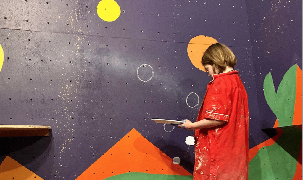 Youth painting mural